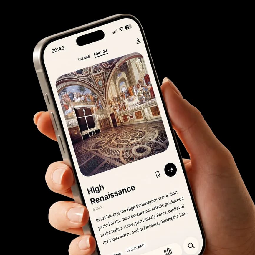 Hand holding an iPhone showing the Noys feed